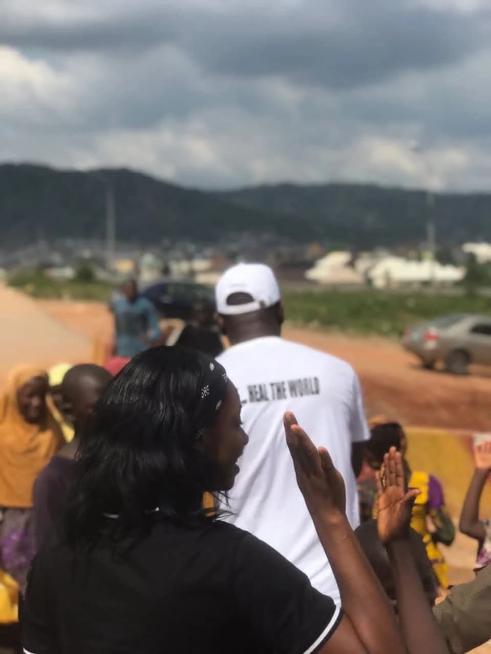 Peace greeting community members at an Agaga Care Foundation outreach