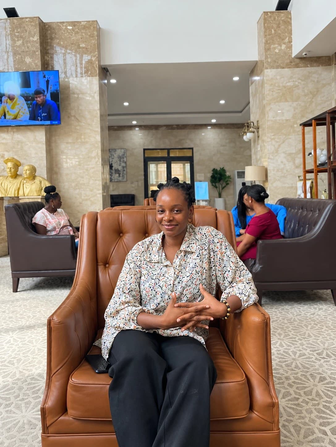 Peace smiling in a leather armchair