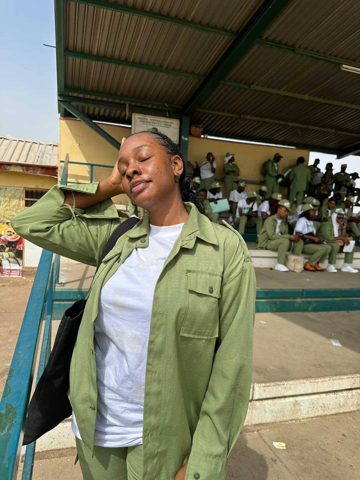 Peace in her NYSC uniform at camp